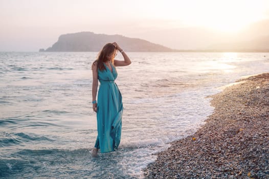 A woman in a flowing green dress poses on a pier by the sea at sunset, with a Turkey flag waving in the background.