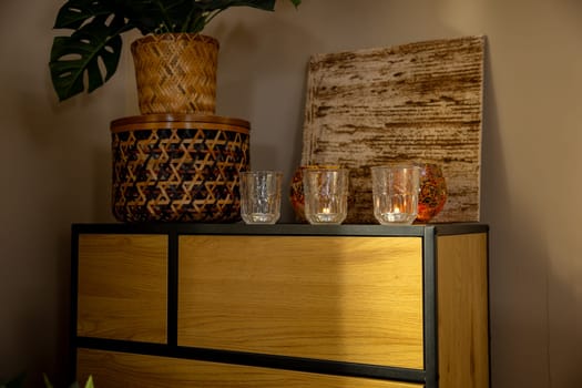 A warm and cozy arrangement that features elegant glassware, natural elements, and modern design aesthetics