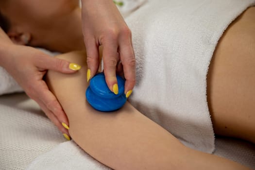 Enjoy a deeply relaxing massage with a blue ball for ultimate muscle relief and escape from daily stress