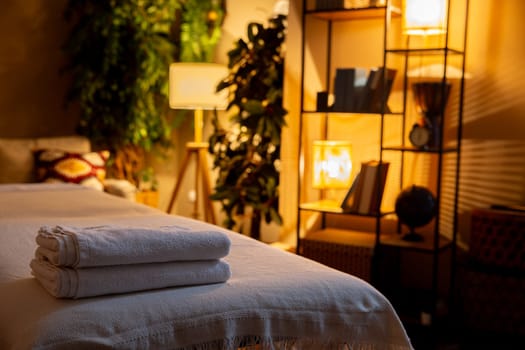 In a relaxing spa setting, youll find neatly arranged towels complemented by warm and soothing lighting