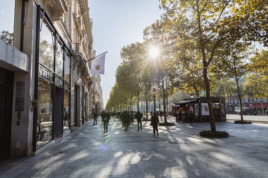 Central street of Paris The Avenue des Champs-Elysees with luxury shops and street life. Paris, France - November 24, 2024
