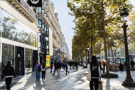 Central street of Paris The Avenue des Champs-Elysees with luxury shops and street life. Paris, France - November 24, 2024