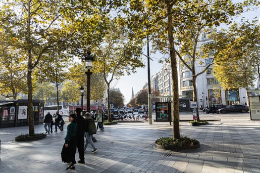 Central street of Paris The Avenue des Champs-Elysees with luxury shops and street life. Paris, France - November 24, 2024