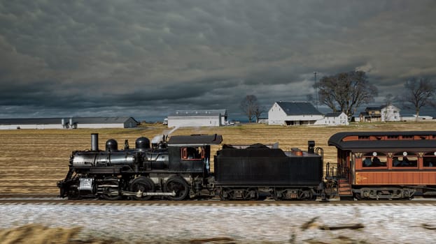 A classic steam locomotive chugs along a railway track, passing vast fields and traditional farm buildings under a moody sky, highlighting a journey through scenic landscapes.