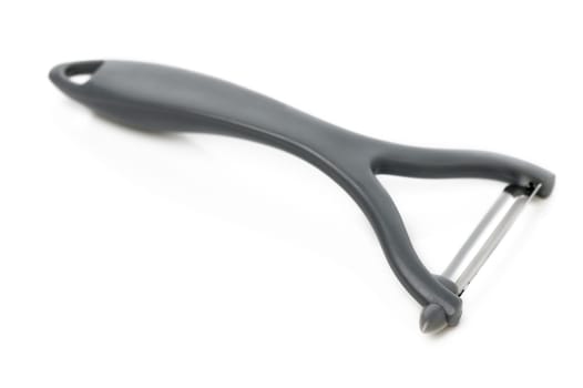 Creative utensil designed for easy peeling of fruits and vegetables during meal prep, enhancing cooking efficiency.