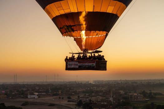 Luxor, Egypt - 31 October 2024: Hot-air balloon over Sahara desert and Valley of Kings near Luxor, Egpyt