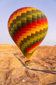 Hot-air balloon over Temple of Hatshepsut at Deir el Bahari and Valley of Kings near Luxor, Egpyt