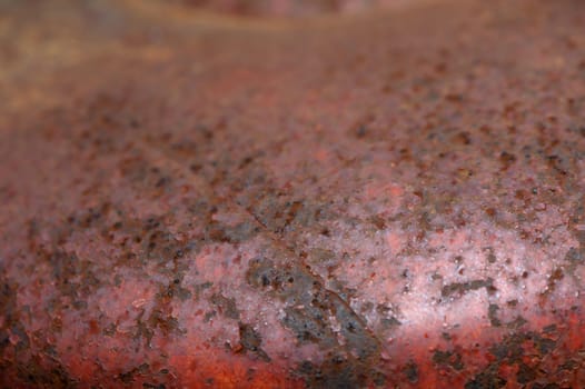 A stunning array of brown and red hues merge to create a rich and textured surface, inviting exploration and attention.