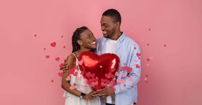 Black couple joyfully celebrates their love, sharing a kiss while holding a large red heart balloon. They are surrounded by floating hearts, symbolizing their bond and affection.