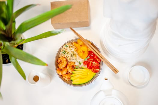 Poke bowl with shrimp on white background. Top view. High quality photo