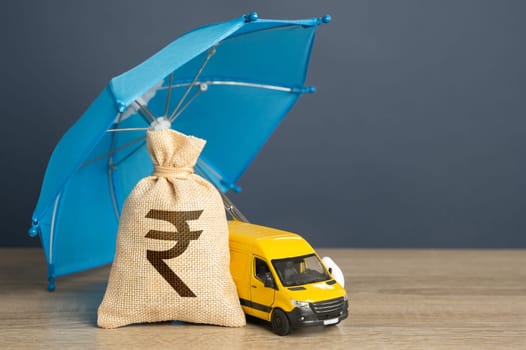 Delivery van and money bag with indian rupees under a blue insurance umbrella. Cargo and parcel insurance. Warranty obligations. Protection in conditions of military aggression. Logistics security.
