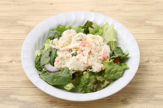 Japanese potato salad in plate on table background