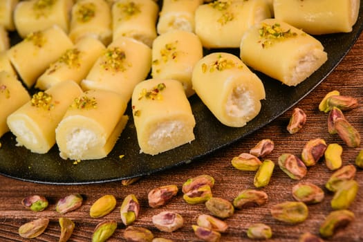 LEBANESE PASTRY RECIPE, ORIENTAL FOOD, HALAWET AL JEBEN, MOZARELLA, ASHTA AND FINE SEMOLINA. High quality photo