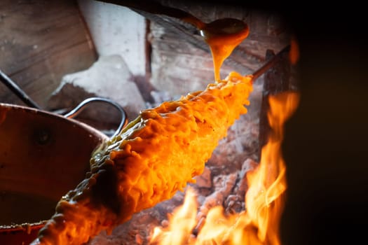 Wood-fired spit-roasted cake, Pyrenees-Atlantique, France. High quality photo