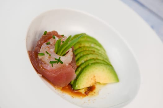 FISH CEVICHE RECIPE, SEA BREAM AND TUNA, AVOCADO, BELL PEPPER, CHILLI, CHIVES, LEMON, OLIVE OIL, BLUE POPPY SEEDS, SALT, High quality photo