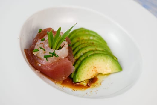 FISH CEVICHE RECIPE, SEA BREAM AND TUNA, AVOCADO, BELL PEPPER, CHILLI, CHIVES, LEMON, OLIVE OIL, BLUE POPPY SEEDS, SALT, High quality photo