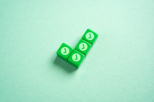 Green checkmark made of blocks with small checkmarks. Divide the work into parts for its easy execution. Concept of planning and dividing the work.
