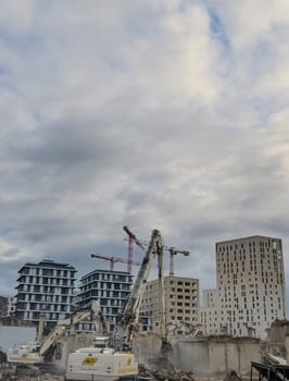 France, Bordeaux 01.20.2025, Building demolition excavator with mechanical arm. Destruction of houses. Heavy machinery, hydraulic construction equipment. High quality photo