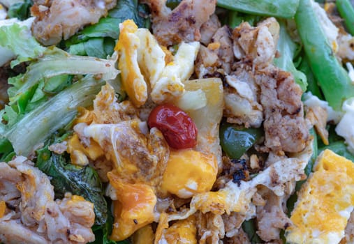 Close-up of Homemade sliced chicken and fried egg, cherry tomatoes with salad featuring variety fresh green vegetables. Healthy eating lifestyle concept, use it as your Wallpaper, Poster and Space for text, Selective focus.