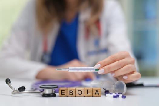 A healthcare professional emphasizes Ebola awareness using essential medical tools for safe education and care