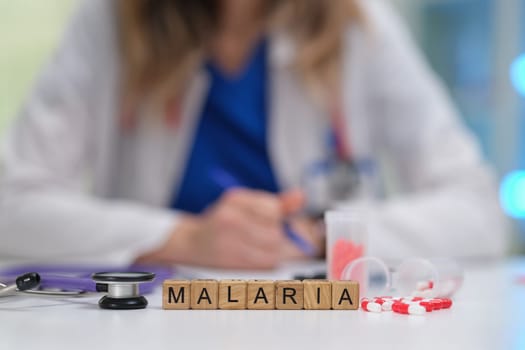A medical expert focused on raising malaria awareness and providing treatments using lab equipment for accurate care