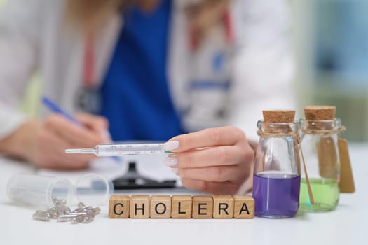 A dedicated doctor diligently studies cholera using various test tubes and biological samples in a lab setting