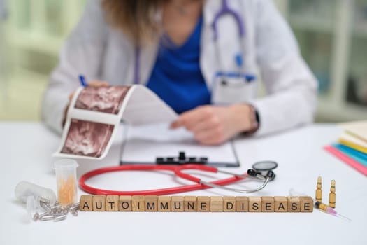 A skilled doctor reviews information on autoimmune diseases using advanced tools and patient records