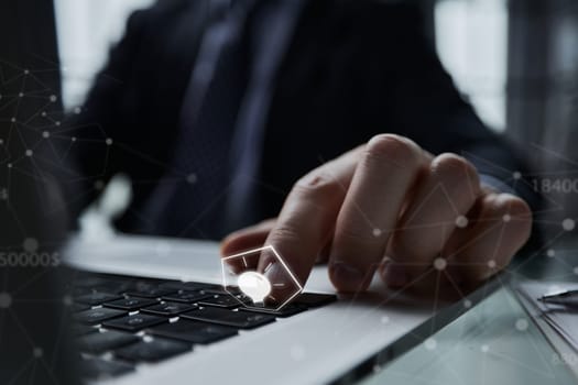 side view of man at laptop pressing button with finger