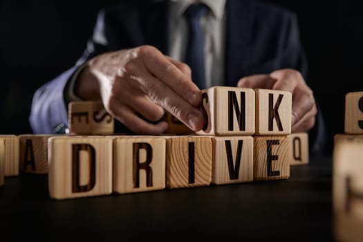 Drive or drink. The cubes form the words Drive - drink.