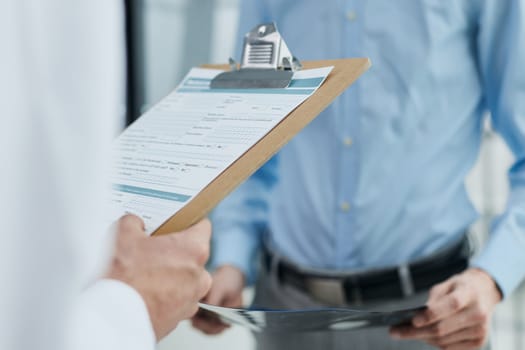 male doctor with a folder in uniform