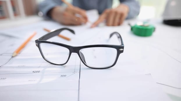 glasses on a construction drawing in the office