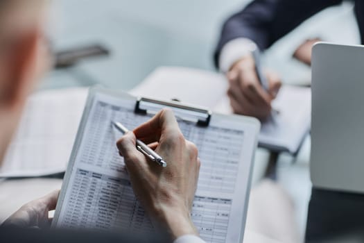 Financial Business man analyze the graph of the company's performance to create profits and growth