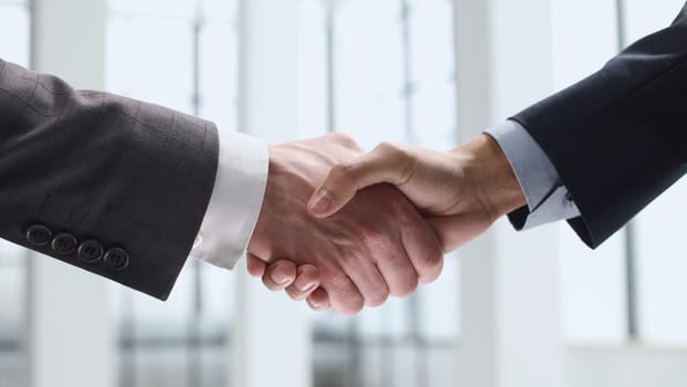 Handshake, agreement after the transaction.