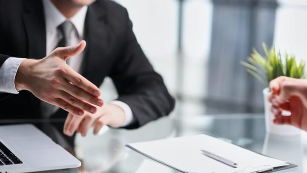 Professional business people reached agreement on negotiations.