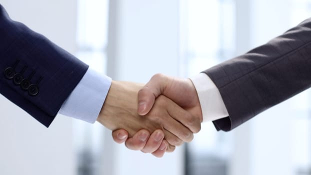 Handshake, agreement after the transaction.