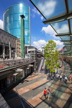 Rotterdam, Netherlands – June 17, 2019: Sunken shopping passage the Koopgoot with the world trade center on the left side in Rotterdam