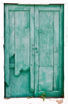 Old green broken wooden door on Lanzarote in Spain