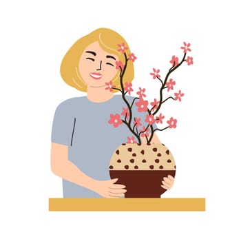 Self love concept with woman holding blossoming cherry tree in pot for relaxation and mindfulness.