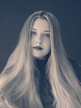 Woman, monochrome portrait with soft focus, long flowing hair and serene expression. Timeless beauty, elegant pose, and captivating look, style