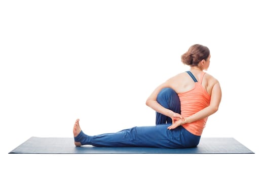 Woman doing Ashtanga Vinyasa Yoga stretching asana Marichyasana C - pose posture dedicated to sage Marichi on white background