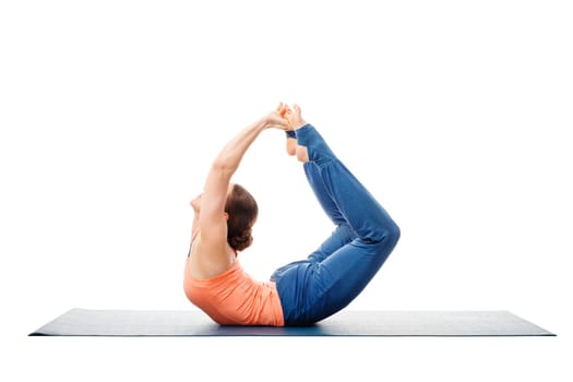 Sporty fit woman dooing yoga back bend asana Dhanurasana - bow pose isolated on white