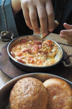 Turkish Menemen omelet in a frying pan.