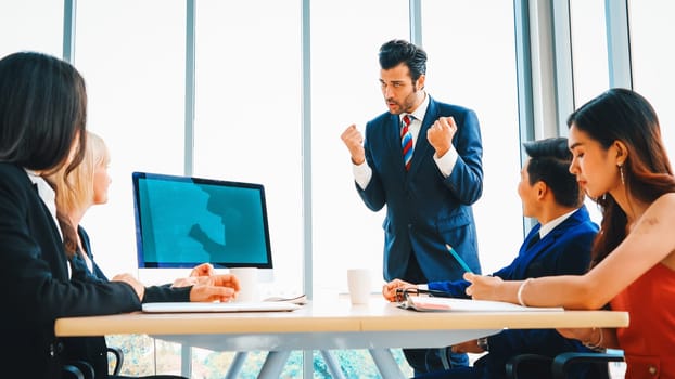 Business people in the conference room with green screen chroma key TV or computer on the office table. Diverse group of businessman and businesswoman in meeting on video conference call . Jivy