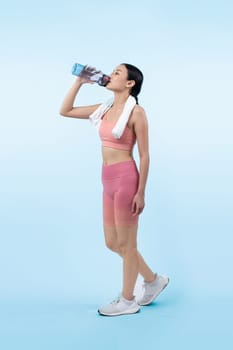 Athletic and sporty asian woman resting and drink water after intensive cardio workout training. Healthy exercising and fit body care lifestyle pursuit in studio shot isolated background. Vigorous