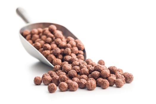 Breakfast cereal chocolate balls in scoop isolated on a white backgorund.
