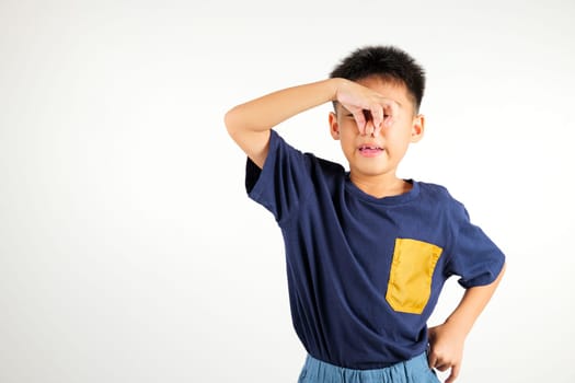 Asian young child unhappy what a smell disgust expression squeezing nose with fingers. Kid boy primary have something stinks bad smell situation, studio shot isolated on white background, Healthcare
