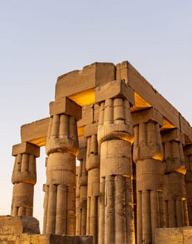 Massive numerous stone columns supporting roof of Luxor Temple in Egypt
