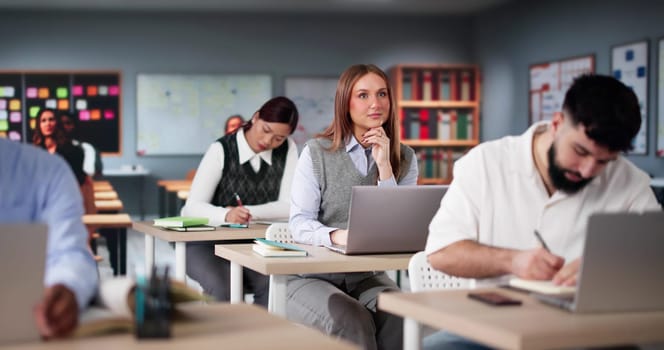 Diverse College Students Group In Classroom With Laptop Computers