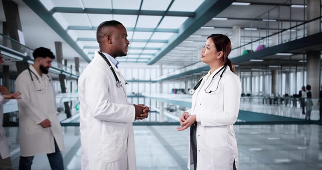 Happy Friendly Doctor Talking In Modern Hospital