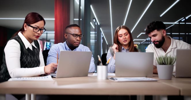 Predictive Business Analytics On Laptop Computer. Group Of Analysts